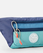 Riñonera Rip Curl Rip Waist Bag Multicolor en tonos azul y turquesa inspirados en el océano para viajes, playa y surf lifestyle