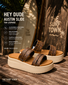 Sandalias Hey Dude Austin Slide Tan Leopard para mujer con plataforma ultraligera en ambiente lifestyle surf premium tropical