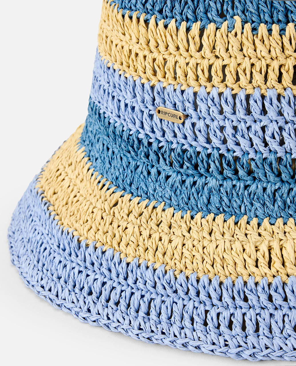 Gorro Rip Curl Crochet Blue Natural tipo bucket de crochet en tonos azul y natural para playa, verano y estilo surf lifestyle