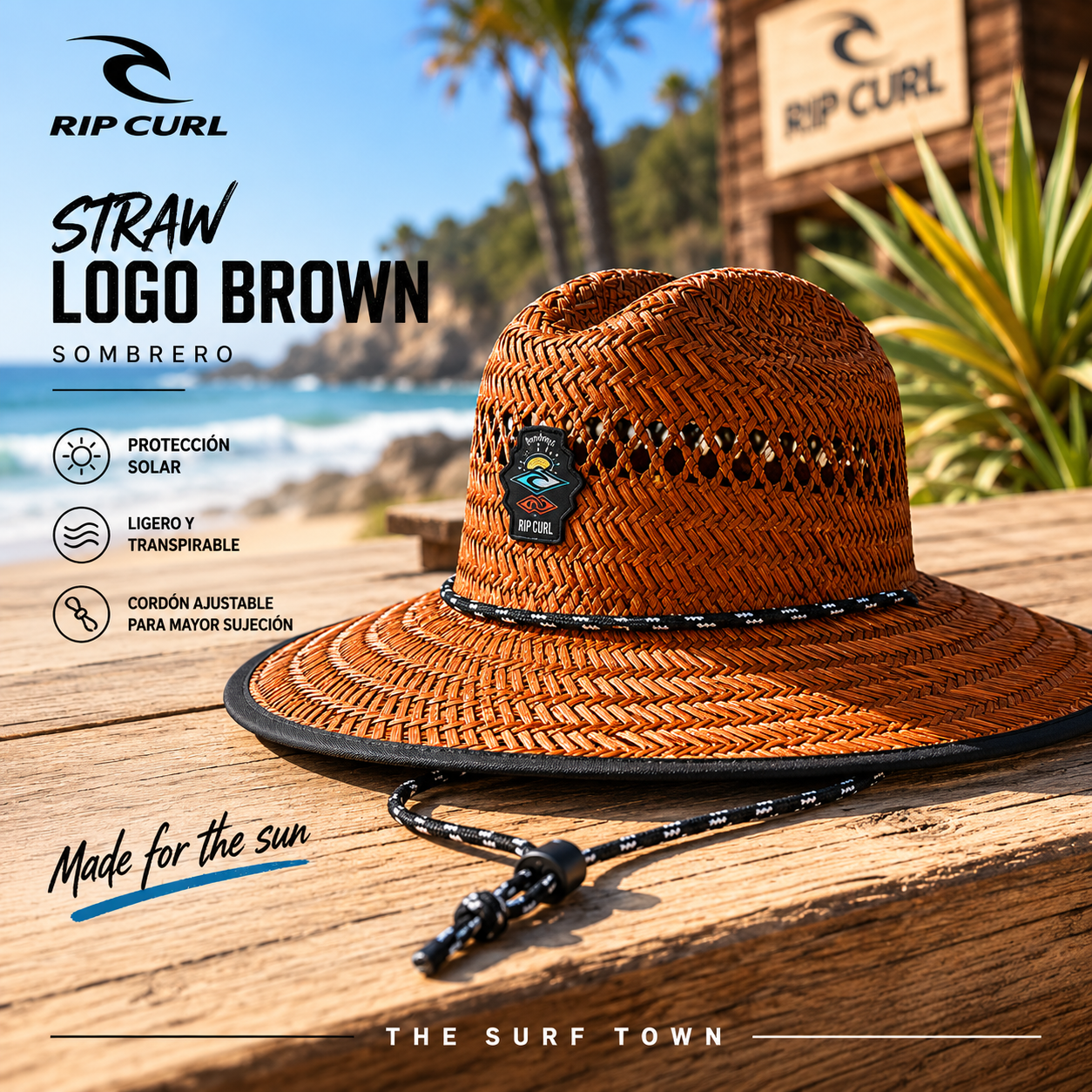 Sombrero Rip Curl Straw Logo Brown sobre mesa de madera frente al mar, fotografía editorial propia de THE SURF TOWN con estilo surf lifestyle premium y protección solar para verano