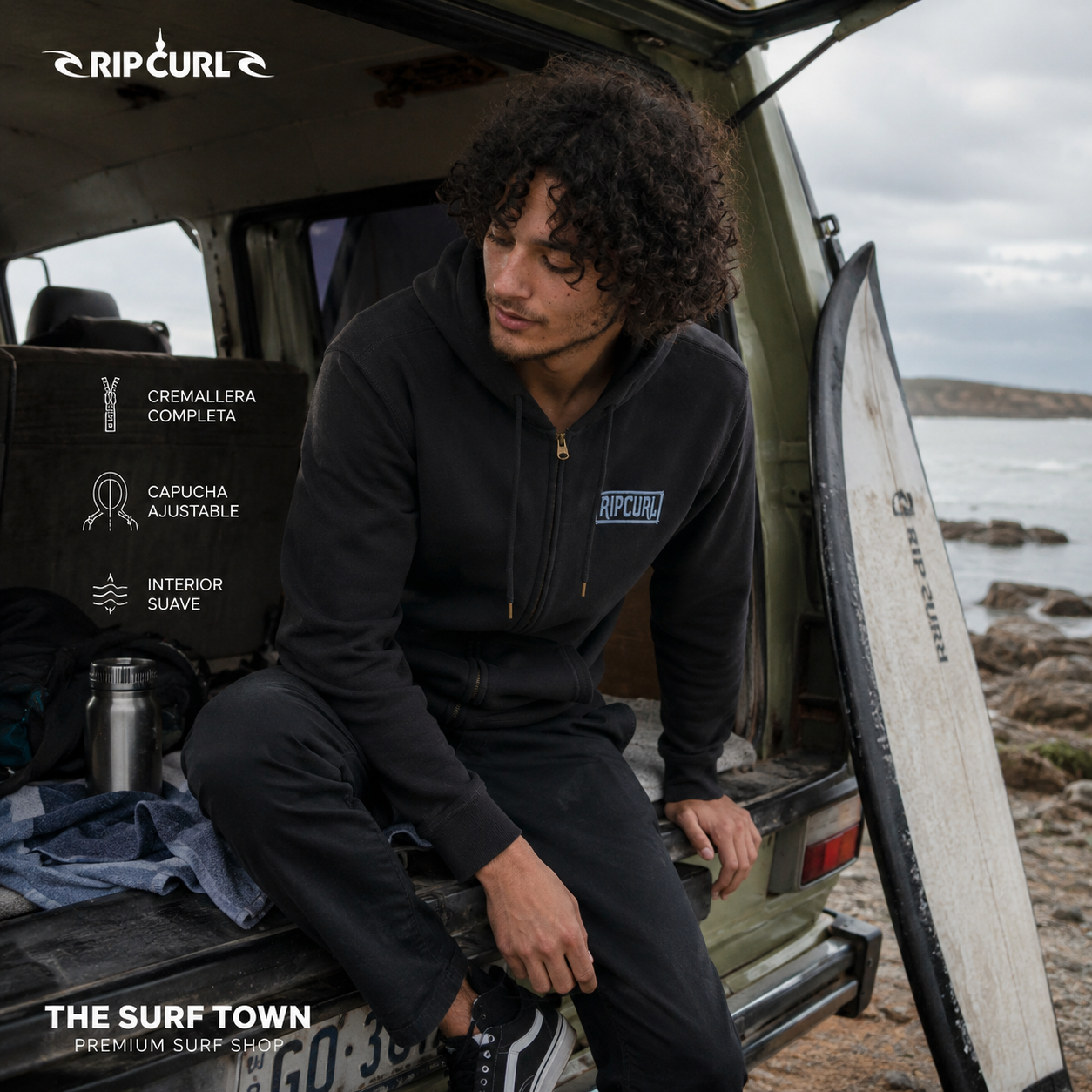 Sudadera Rip Curl Made For Zip Washed Black para hombre junto a una furgoneta de surf frente al océano, imagen editorial propia de THE SURF TOWN en furgoneta en la playa