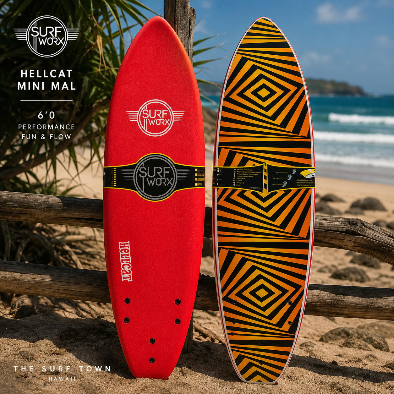 Tabla de Surf SurfWorx Hellcat Mini Mal 6.0 en fotografía editorial propia de THE SURF TOWN sobre arena junto al mar mostrando deck y bottom con diseño softboard para iniciación y progresión
