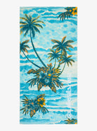 Toalla de playa QUIKSILVER Freshness Aqua Sundown con diseño tropical en tonos azul y palmeras, ideal para surf, piscina o verano, con secado rápido y gran absorción