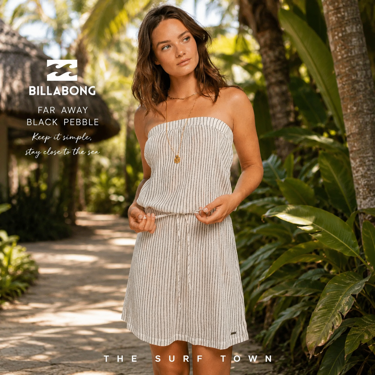 Vestido Billabong Far Away Black Pebble en fotografía editorial propia de THE SURF TOWN en sendero tropical de resort premium con estilo surf lifestyle femenino
