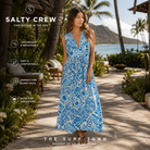 Vestido Salty Crew Windward Maxi Dress Bold Blue en resort de lujo en Hawái, fotografía editorial propia de THE SURF TOWN con modelo lifestyle femenino, vestido maxi estampado azul y estilo tropical premium para verano