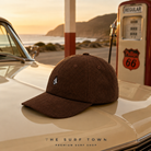 Gorra Volcom Full Stone Corduroy Cacao en gasolinera retro costera - editorial cuadrada The Surf Town