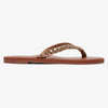 Sandalias Roxy Livia Bronze con tiras doradas trenzadas y pin roxy con suela marron